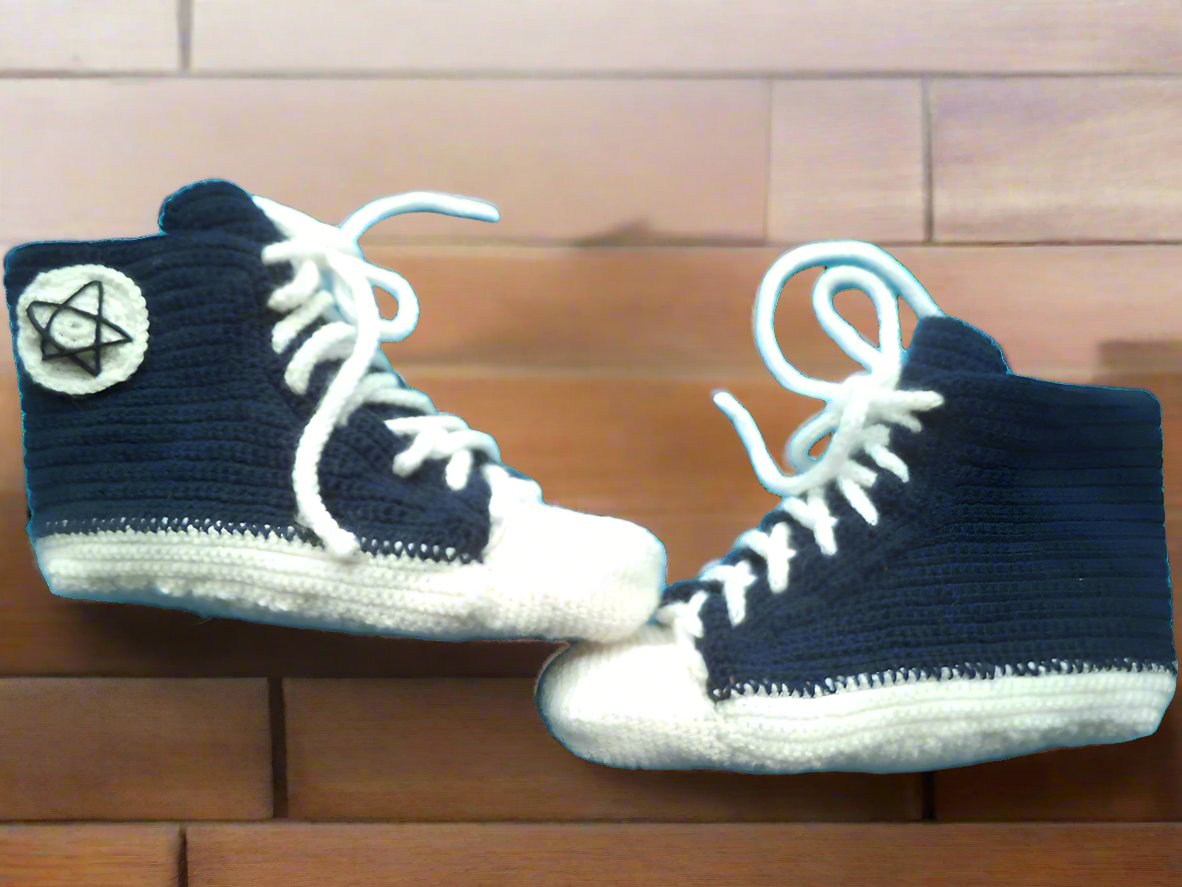 Handmade high-top crochet sneakers with white soles and laces, featuring colorful yarn for a unique style