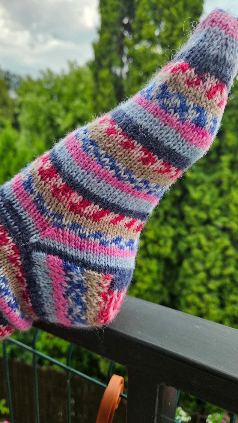 A pair of stylish unisex knitted socks featuring a modern design, showcasing a blend of vibrant colors and patterns, perfect for any outfit